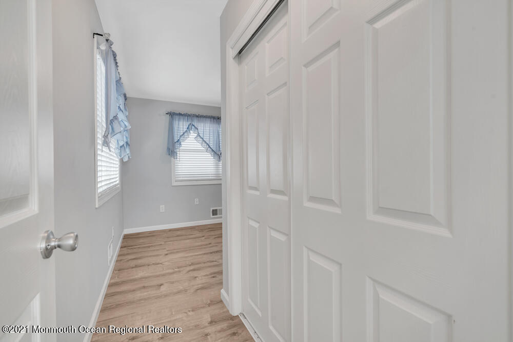 42 Harborage Avenue Bayville, NJ 08721 - Photo 18 of 35 a view of a hallway with wooden floor and entryway