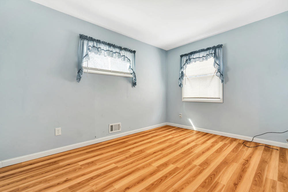 42 Harborage Avenue Bayville, NJ 08721 - Photo 26 of 35 a view of an empty room with wooden floor and a window