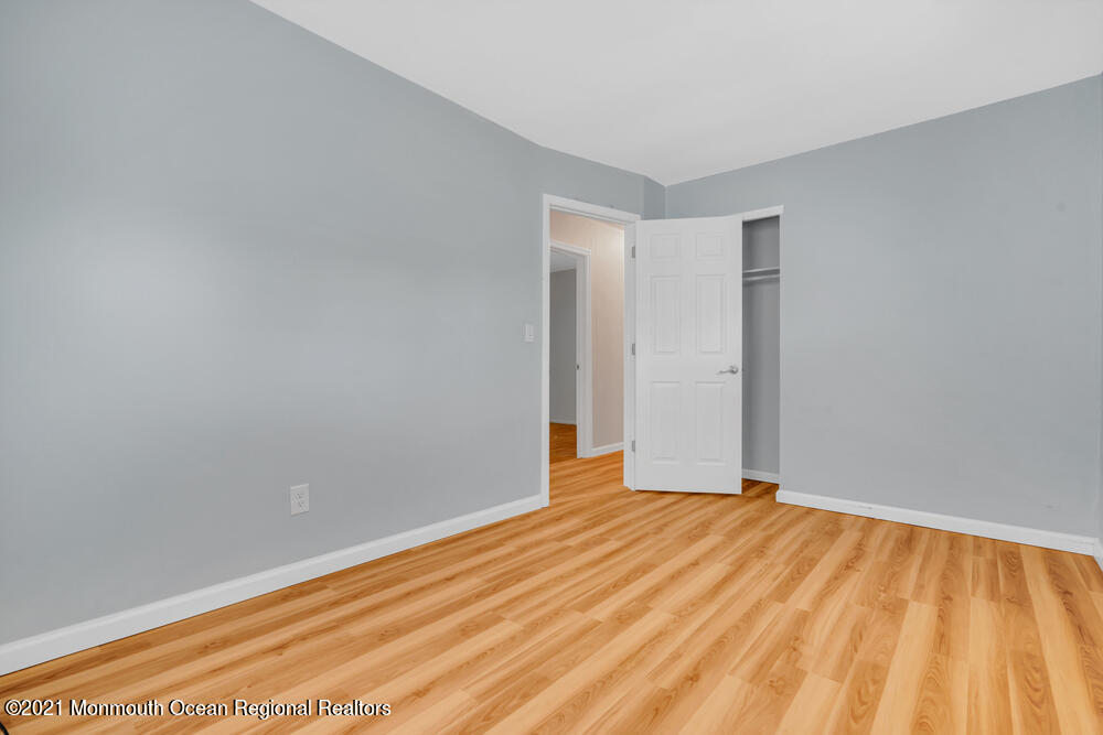 42 Harborage Avenue Bayville, NJ 08721 - Photo 27 of 35 a view of an empty room with wooden floor