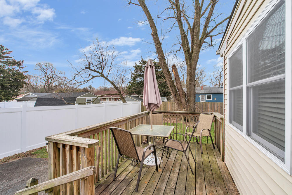 42 Harborage Avenue Bayville, NJ 08721 - Photo 29 of 35 a balcony with wooden floor and outdoor seating