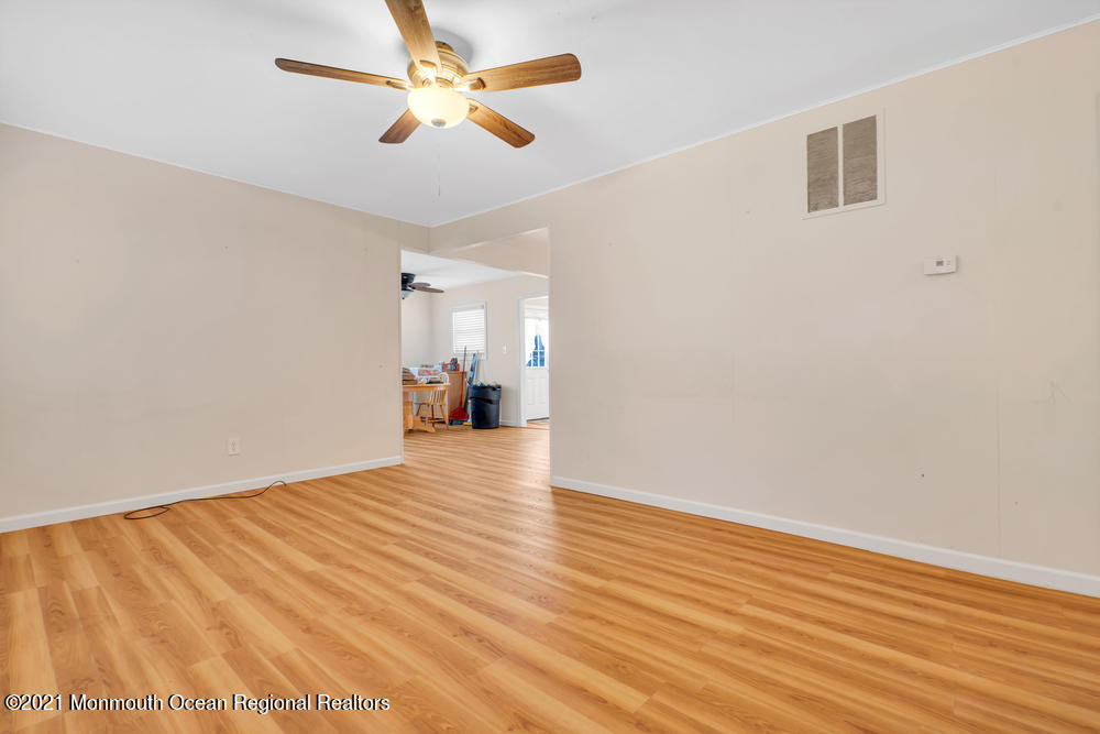 42 Harborage Avenue Bayville, NJ 08721 - Photo 4 of 35 a view of empty room with wooden floor