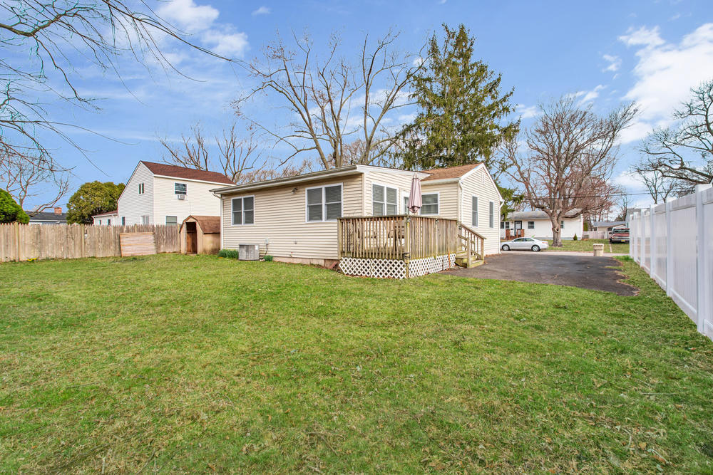 42 Harborage Avenue Bayville, NJ 08721 - Photo 31 of 35 a front view of house with yard and green space