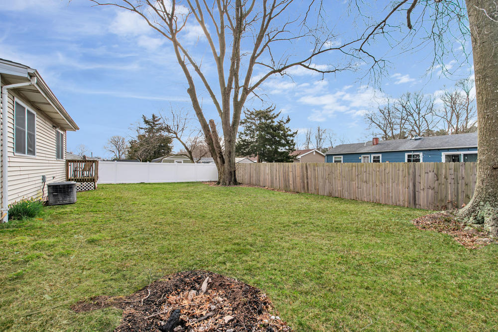 42 Harborage Avenue Bayville, NJ 08721 - Photo 33 of 35 a view of a backyard with a small cabin