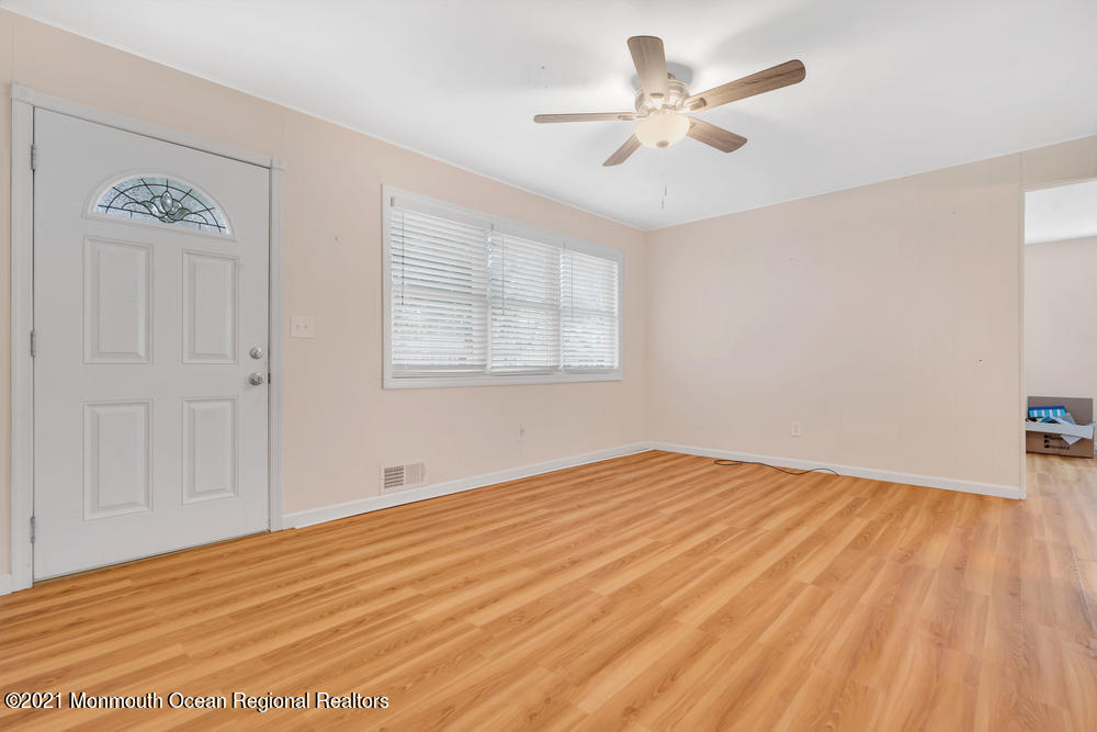 42 Harborage Avenue Bayville, NJ 08721 - Photo 5 of 35 wooden floor in an empty room with a window