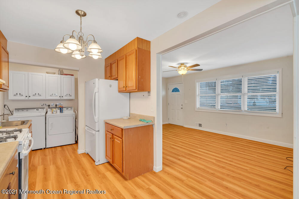 42 Harborage Avenue Bayville, NJ 08721 - Photo 9 of 35 a view of a kitchen with wooden floor and a kitchen
