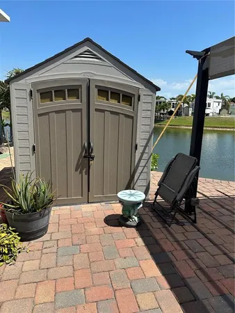 view of a lake with houses in the back
