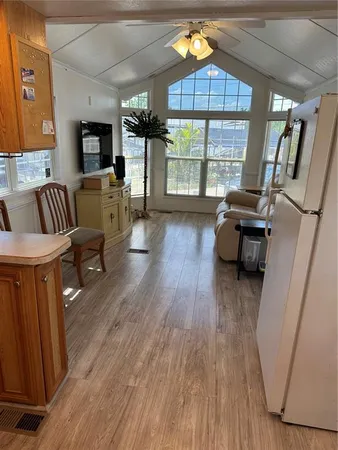a livingroom with furniture window and wooden floor