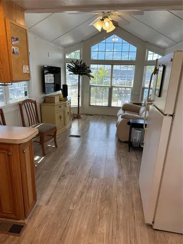 a livingroom with furniture window and wooden floor