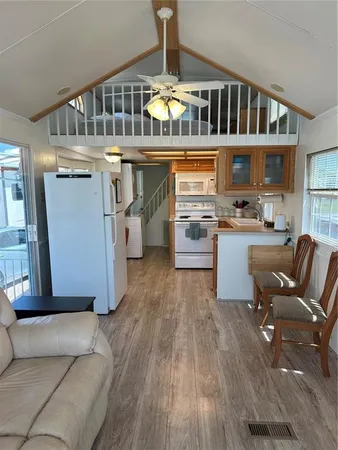a kitchen with a stove top oven sink and cabinets