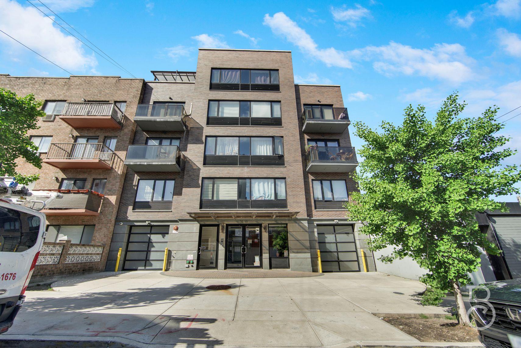 31-10 28th Road, Unit 1A Queens, NY 11102 - Photo 12 of 12 a bricked building with multiple windows