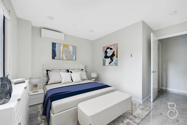 a bedroom with a bed and a cabinets