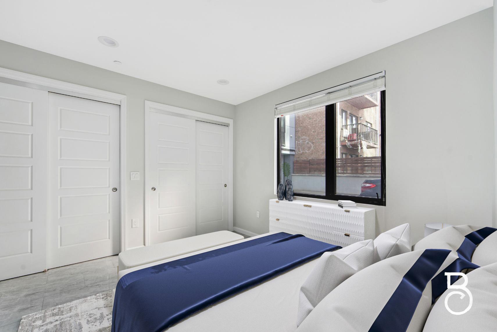 31-10 28th Road, Unit 1A Queens, NY 11102 - Photo 8 of 12 a bedroom with a bed and window