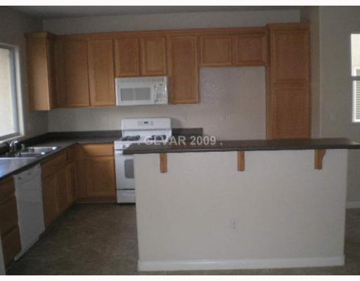 9329 Roping Cowboy Avenue Las Vegas, NV 89178 - Photo 5 of 12 Kitchen.