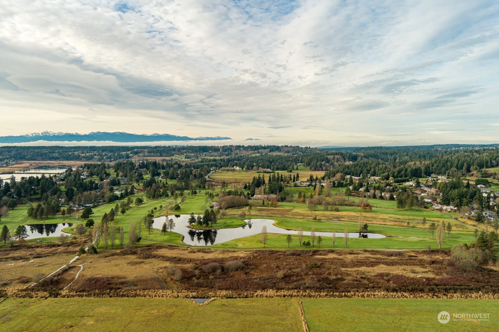 -xxx Bayview Road Langley, WA 98260 - Photo 2 of 13 a view of a lake with a big yard