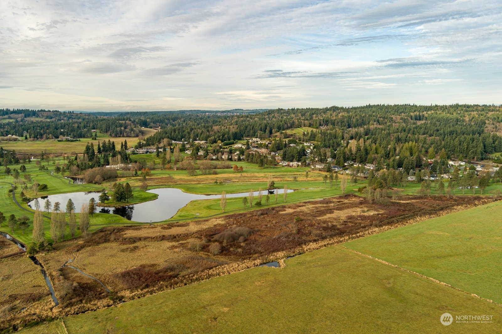 -xxx Bayview Road Langley, WA 98260 - Photo 7 of 13 a view of a lake with a houses