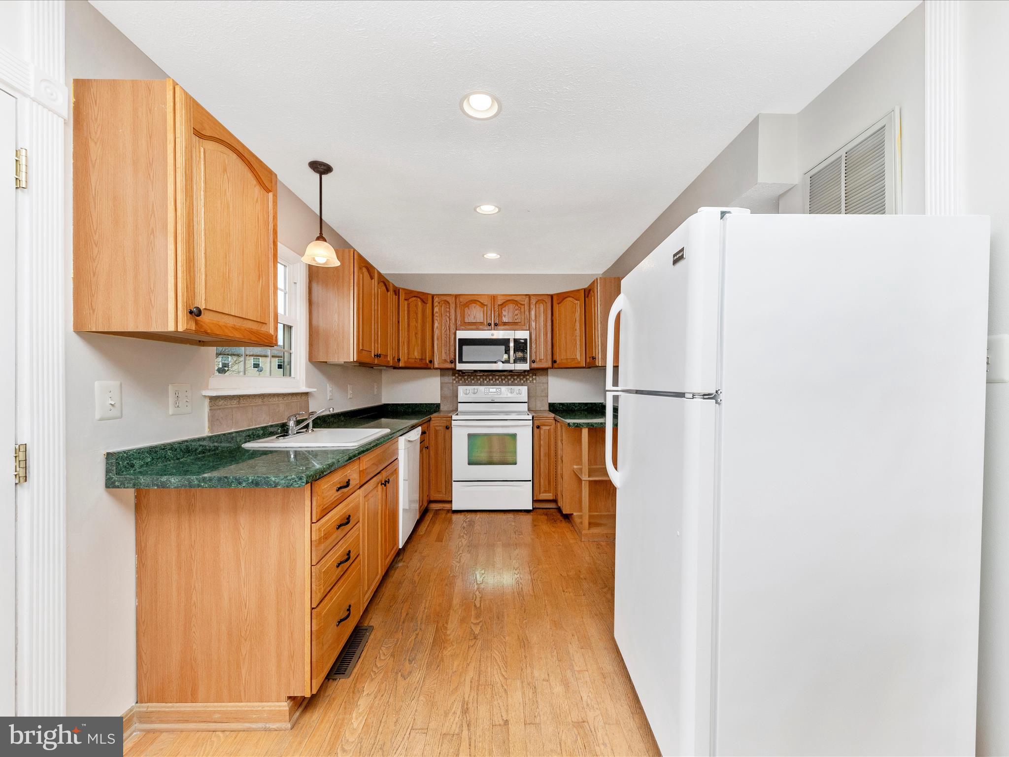 1116 Keswick Place Frederick, MD 21703 - Photo 12 of 53 a kitchen with stainless steel appliances granite countertop a refrigerator a stove and a sink