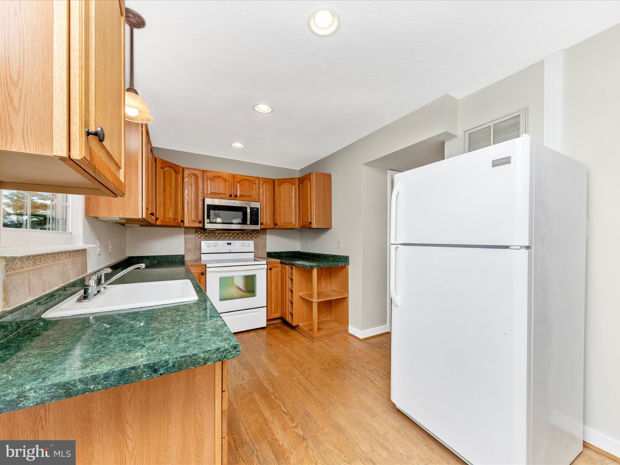 1116 Keswick Place Frederick, MD 21703 - Photo 13 of 53 a kitchen with stainless steel appliances granite countertop a refrigerator a stove and a sink