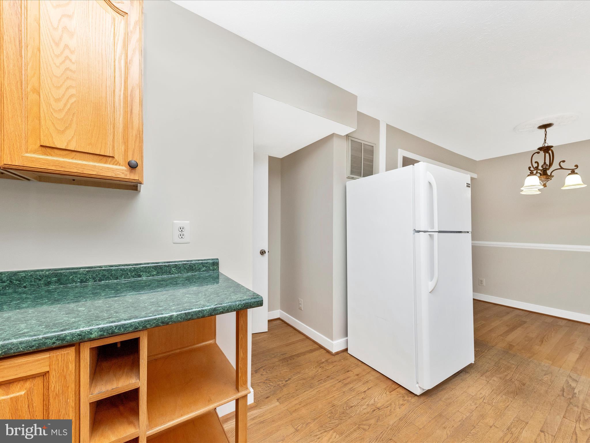 1116 Keswick Place Frederick, MD 21703 - Photo 15 of 53 a kitchen with stainless steel appliances granite countertop a refrigerator and a stove top oven