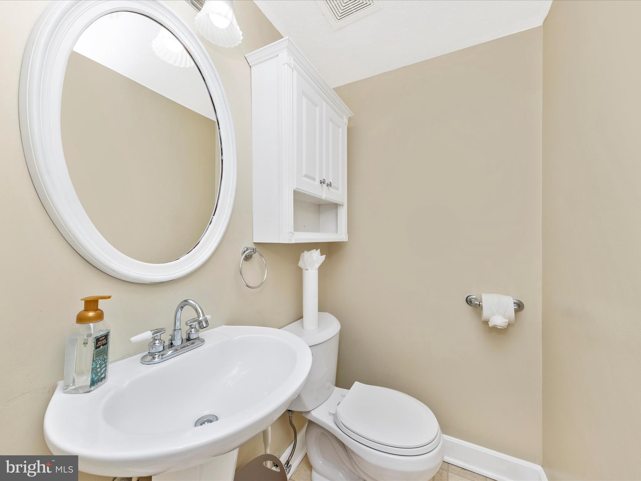1116 Keswick Place Frederick, MD 21703 - Photo 17 of 53 a bathroom with a sink a mirror and a toilet