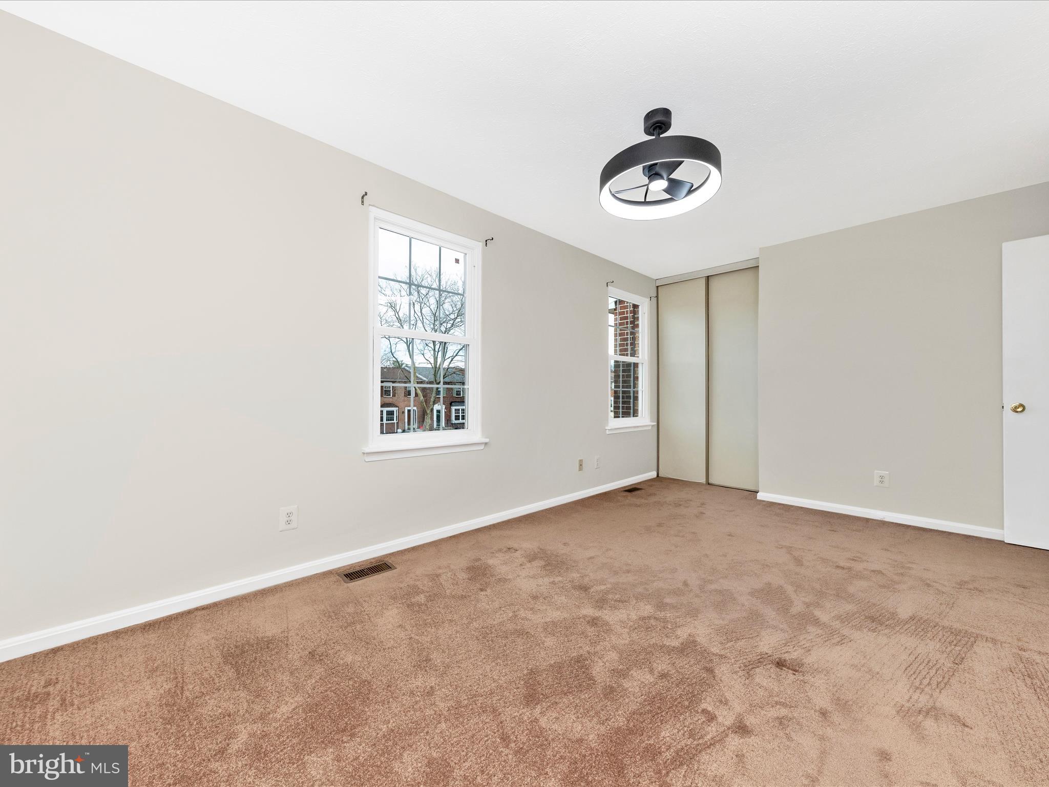 1116 Keswick Place Frederick, MD 21703 - Photo 20 of 53 an empty room with ceiling fan and window