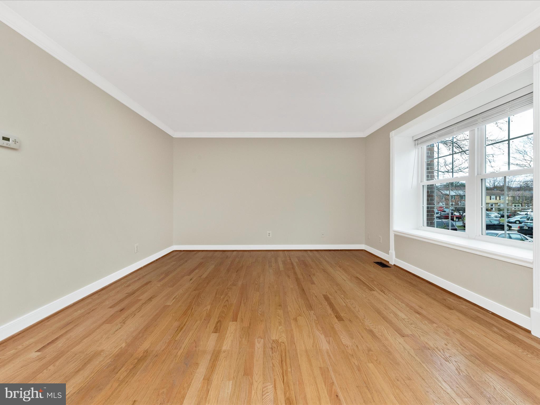 1116 Keswick Place Frederick, MD 21703 - Photo 2 of 53 an empty room with wooden floor and windows