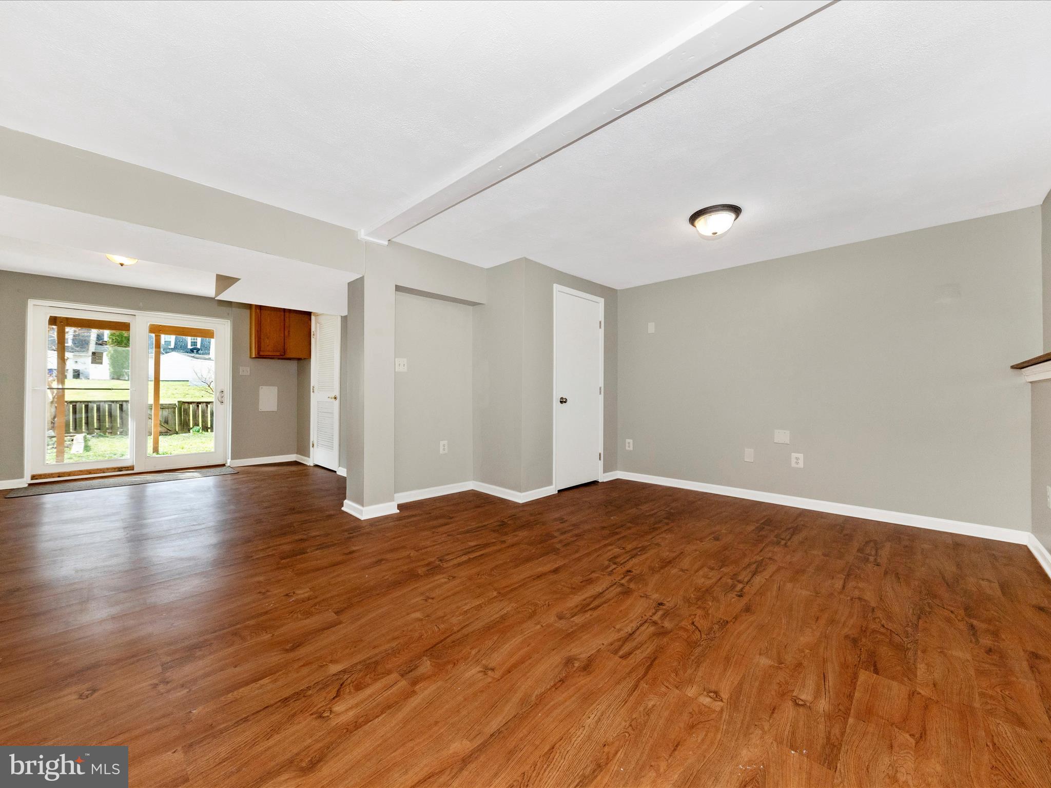 1116 Keswick Place Frederick, MD 21703 - Photo 32 of 53 an empty room with wooden floor and windows