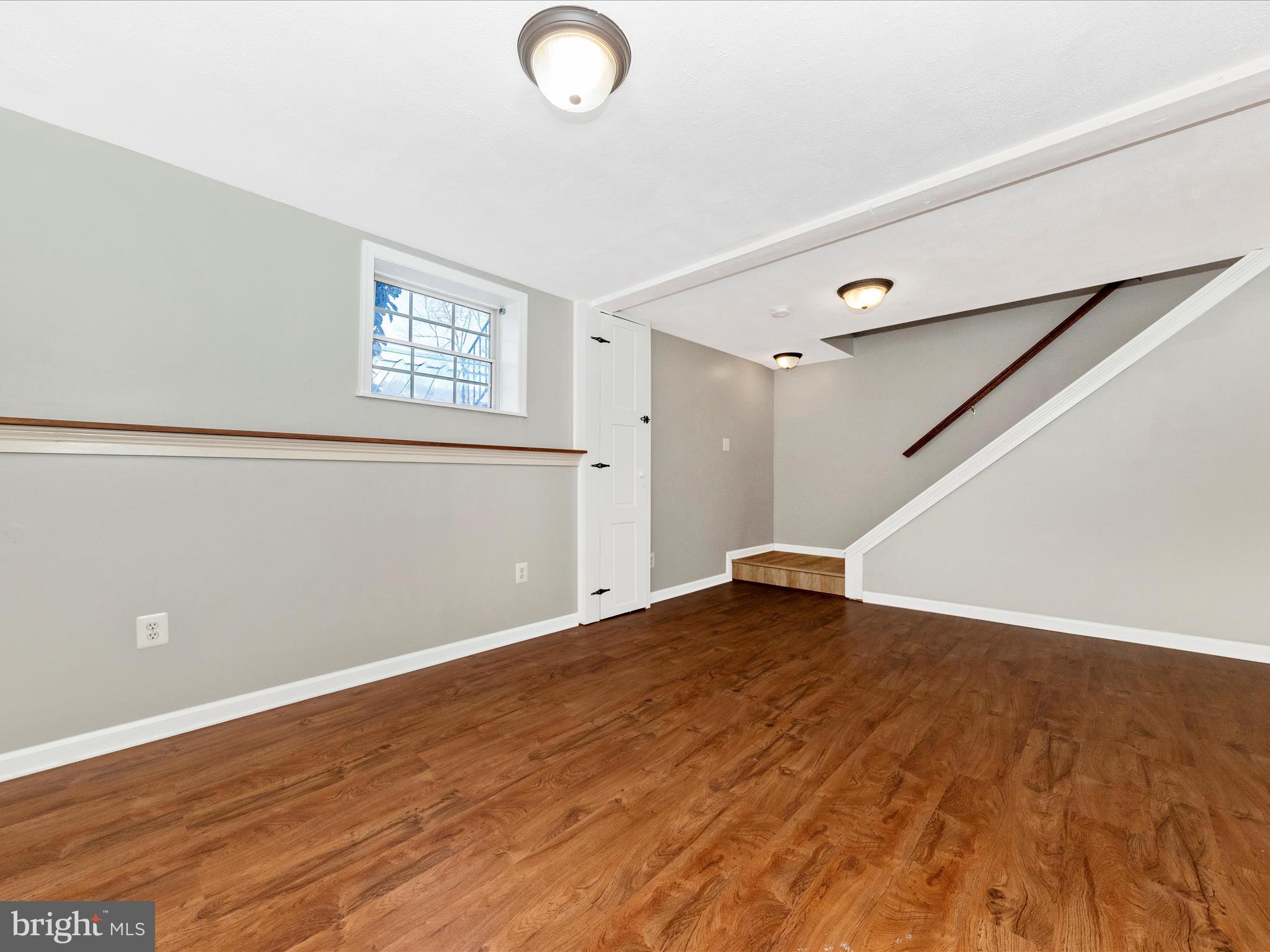 1116 Keswick Place Frederick, MD 21703 - Photo 34 of 53 an empty room with wooden floor and windows