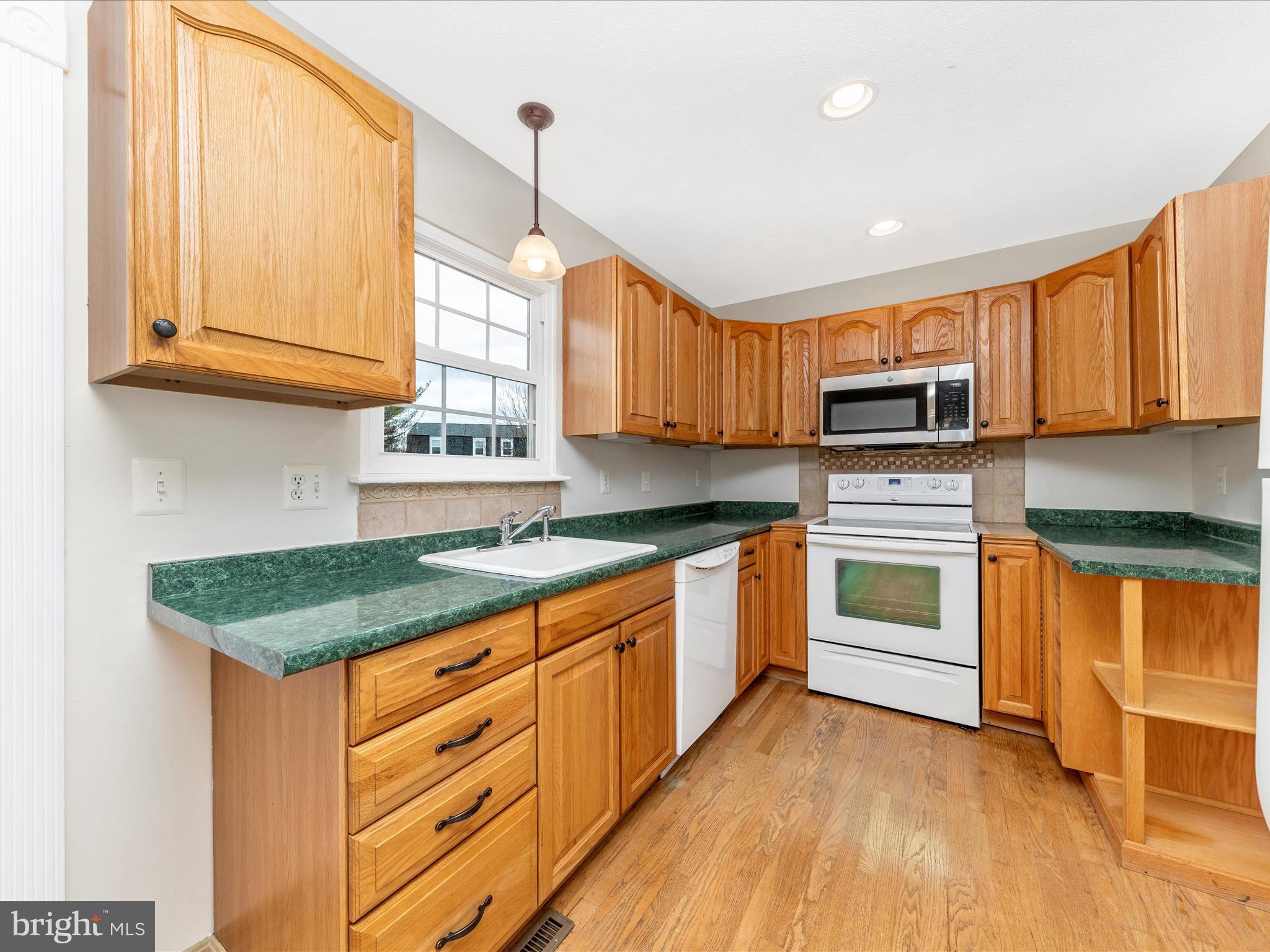 1116 Keswick Place Frederick, MD 21703 - Photo 4 of 53 a kitchen with granite countertop a sink stainless steel appliances and cabinets