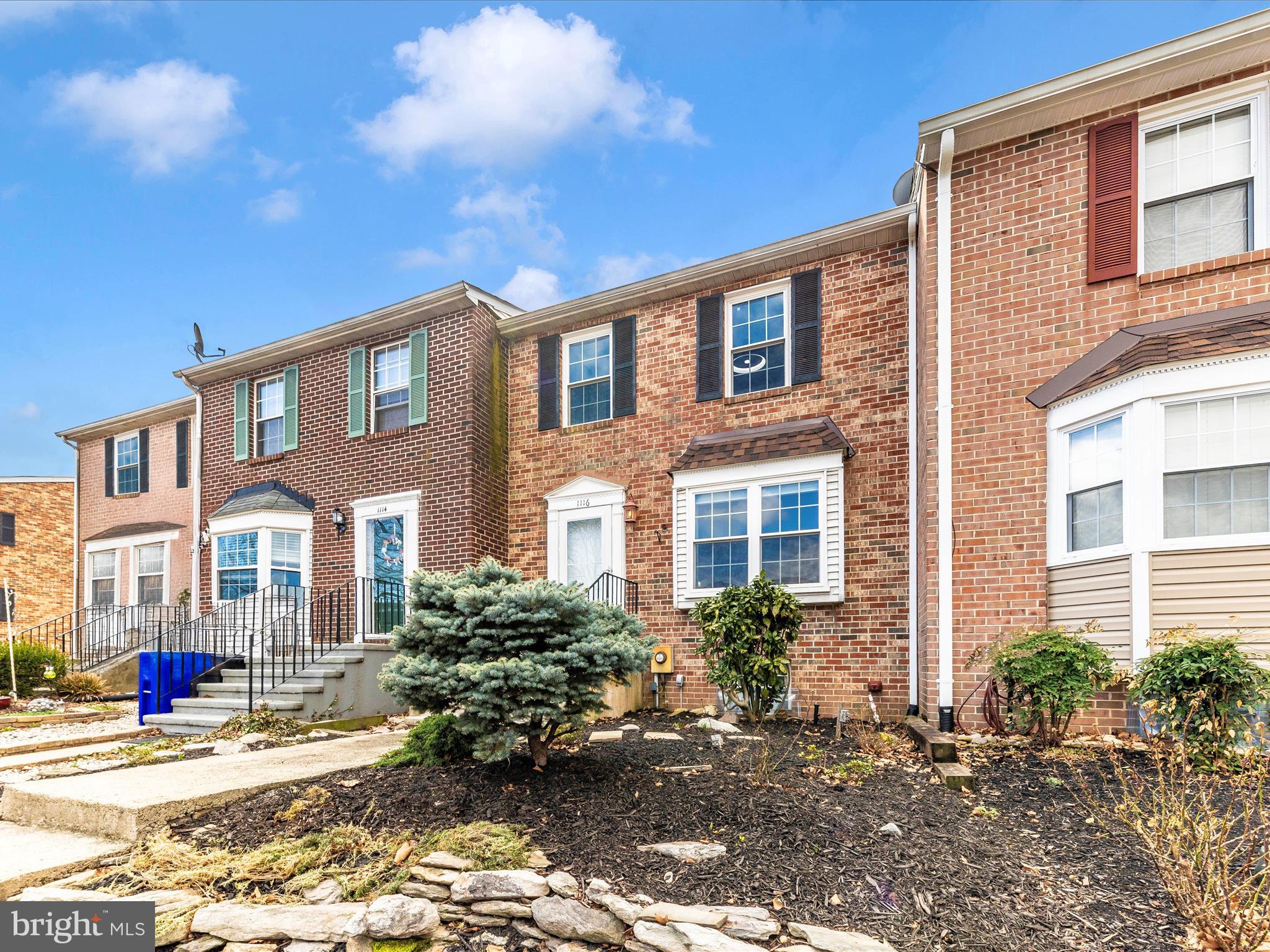 1116 Keswick Place Frederick, MD 21703 - Photo 41 of 53 a view of a brick building next to a yard