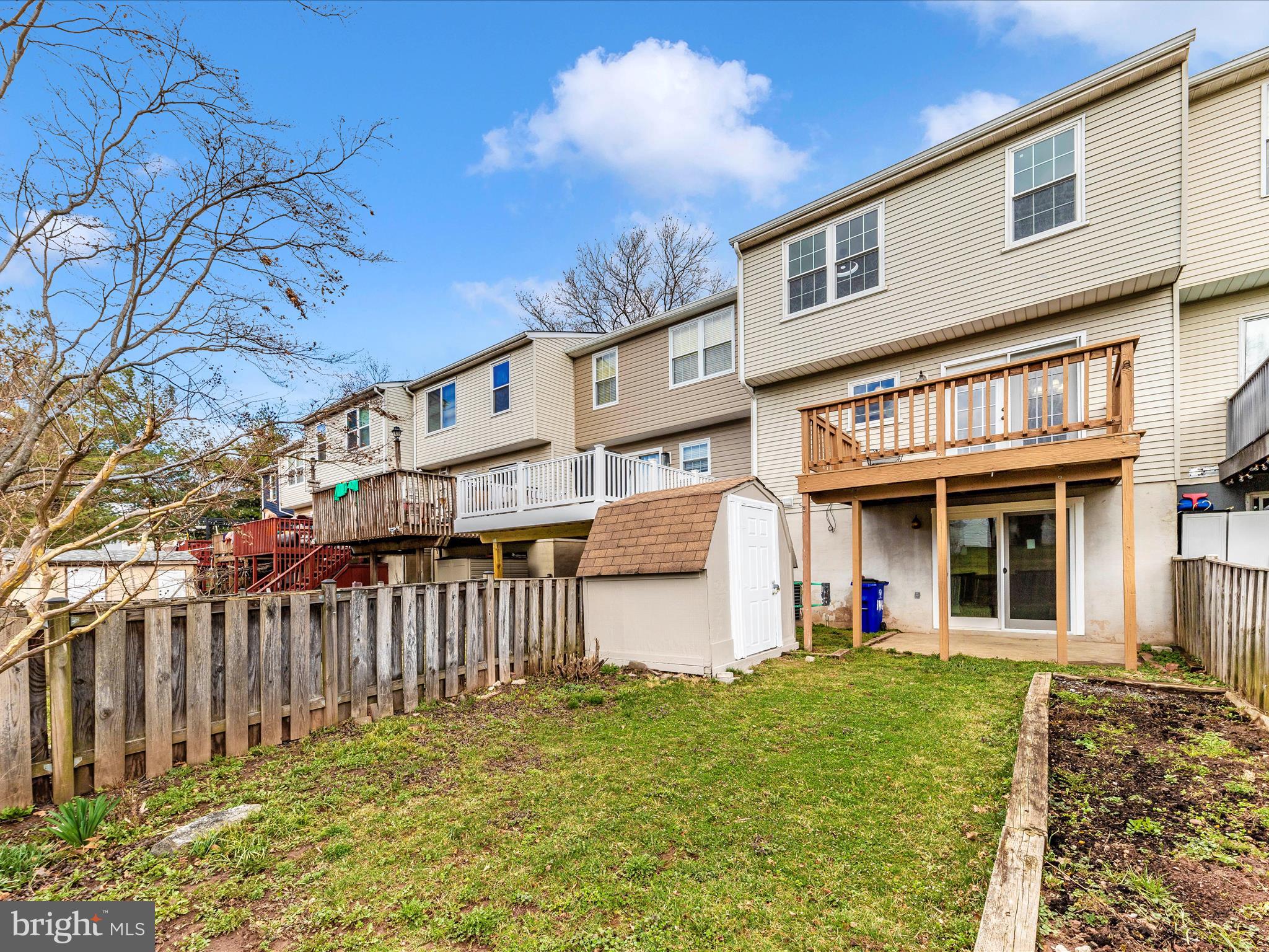 1116 Keswick Place Frederick, MD 21703 - Photo 43 of 53 a view of a house with wooden fence and a tree