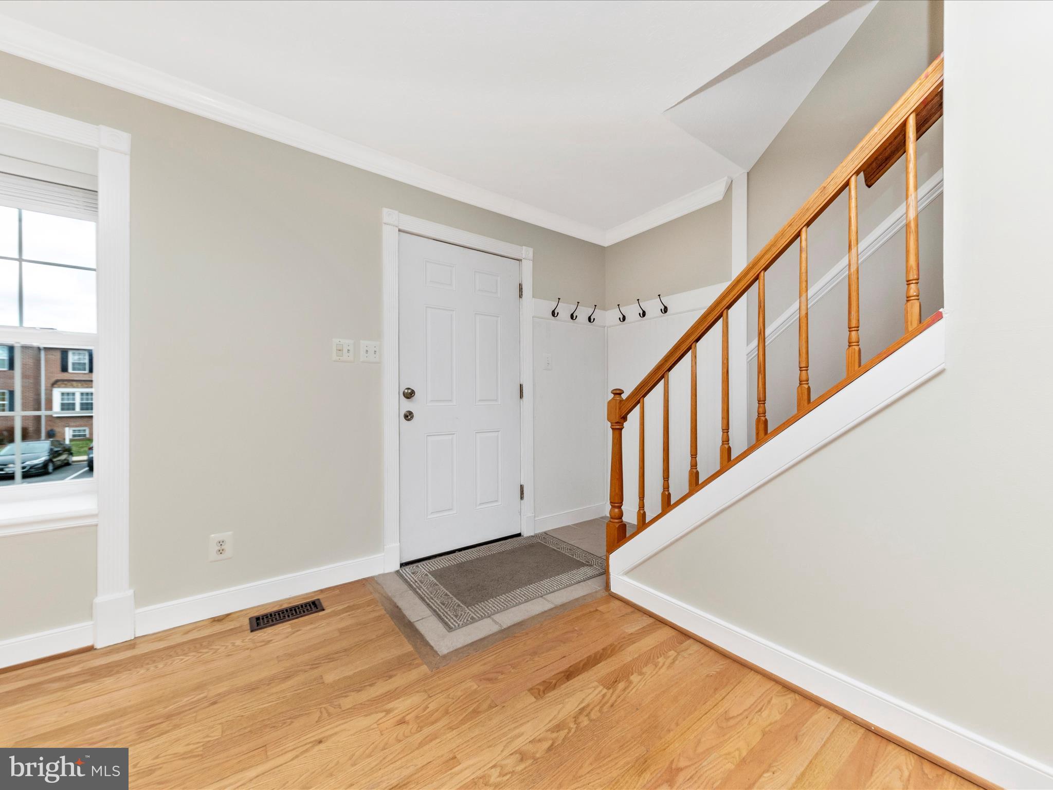 1116 Keswick Place Frederick, MD 21703 - Photo 6 of 53 a view of an entryway with wooden floor