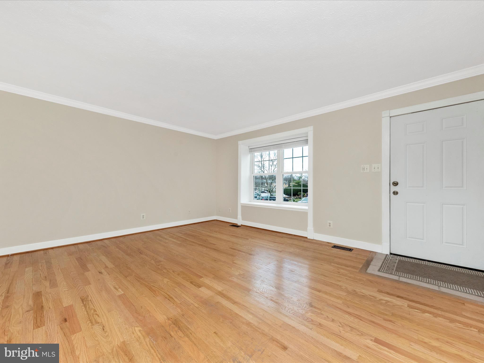 1116 Keswick Place Frederick, MD 21703 - Photo 7 of 53 an empty room with wooden floor and windows