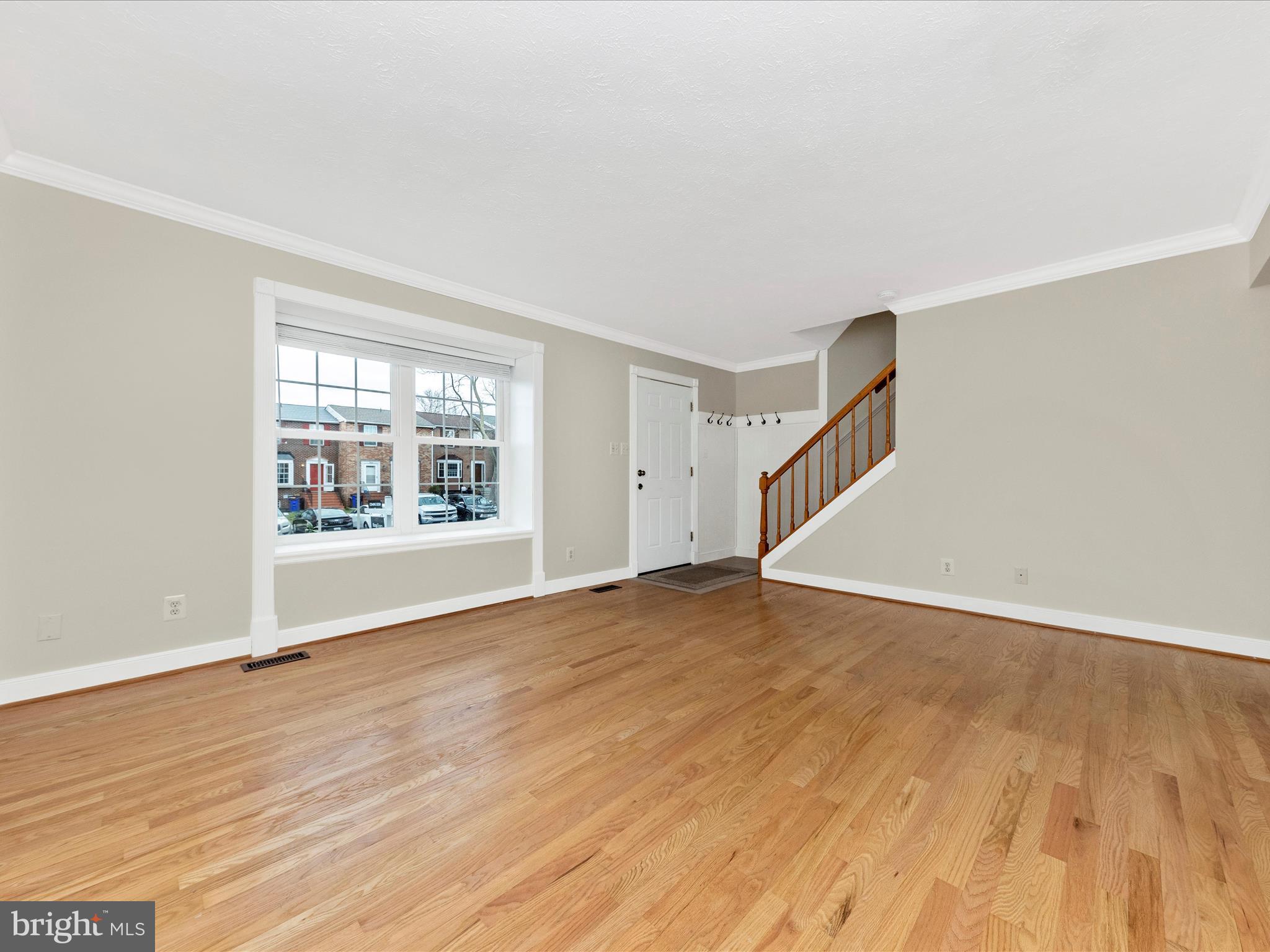 1116 Keswick Place Frederick, MD 21703 - Photo 8 of 53 a view of an empty room with wooden floor and a window