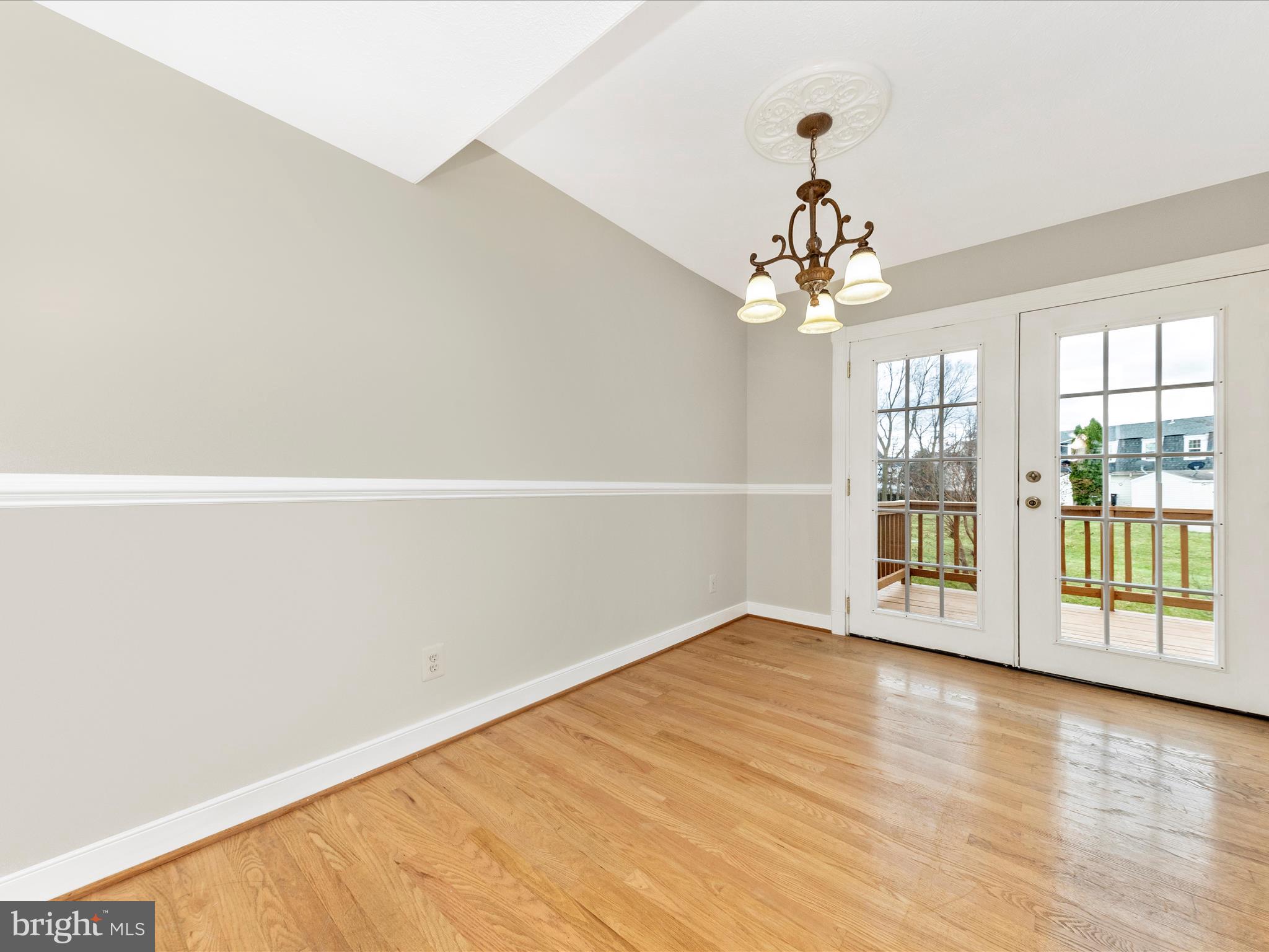 1116 Keswick Place Frederick, MD 21703 - Photo 9 of 53 wooden floor in an empty room with a window