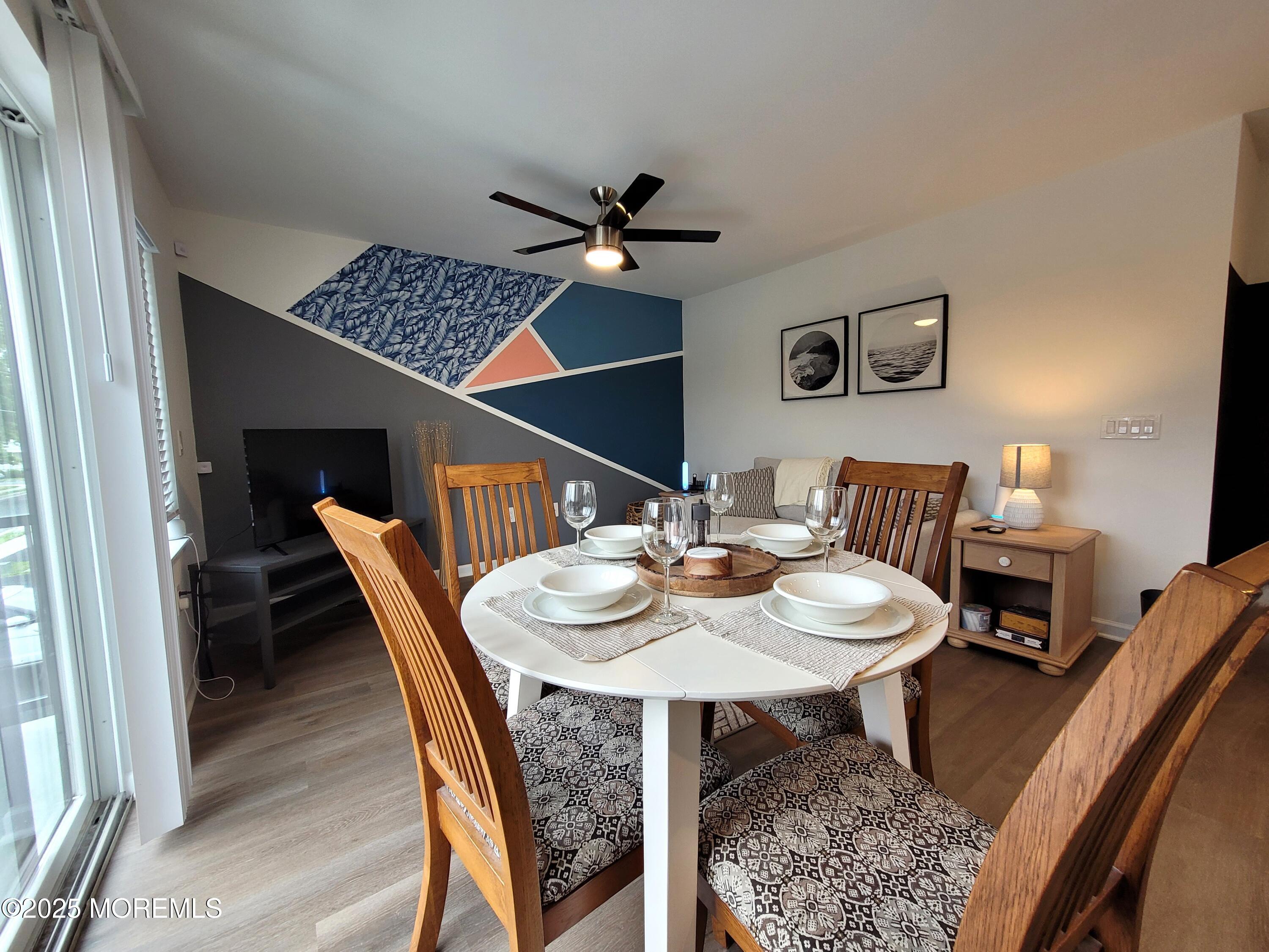a dining room with furniture and window
