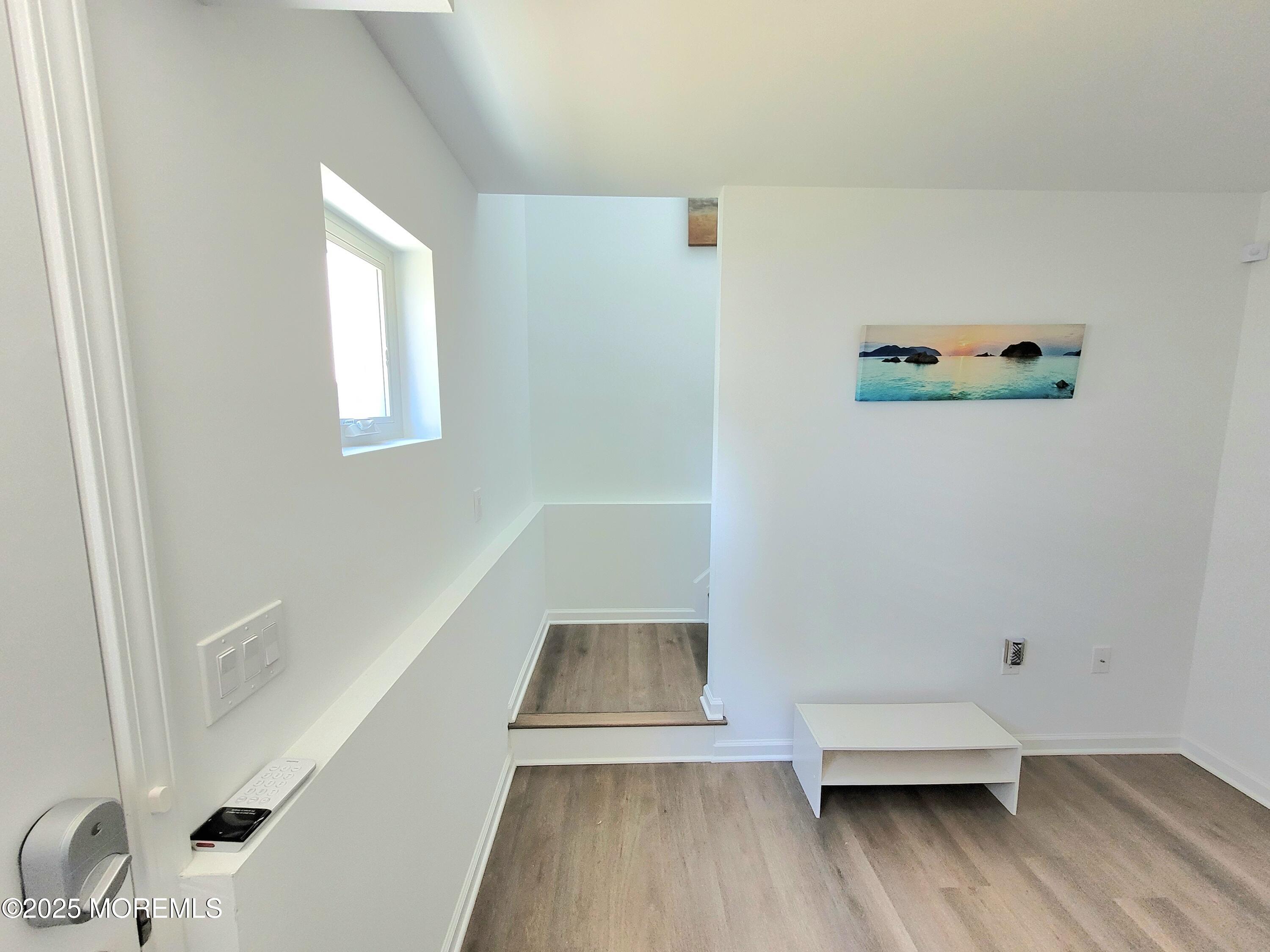1134 Springwood Avenue, Unit B Asbury Park, NJ 07712 - Photo 2 of 19 a view of wooden floor in a bathroom