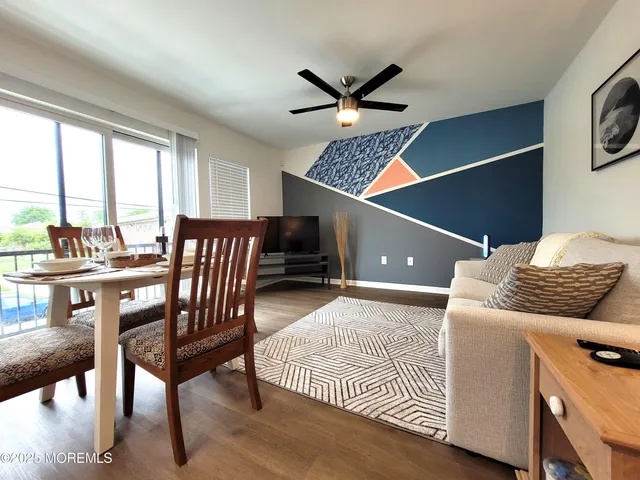 a living room with a bed and furniture