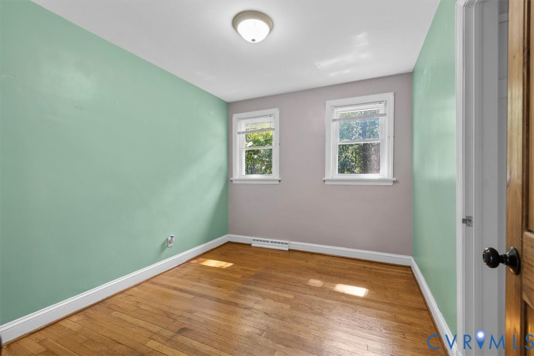 3577 Old Buckingham Road Powhatan, VA 23139 - Photo 26 of 36 Hardwood flooring, two windows with white trim, a