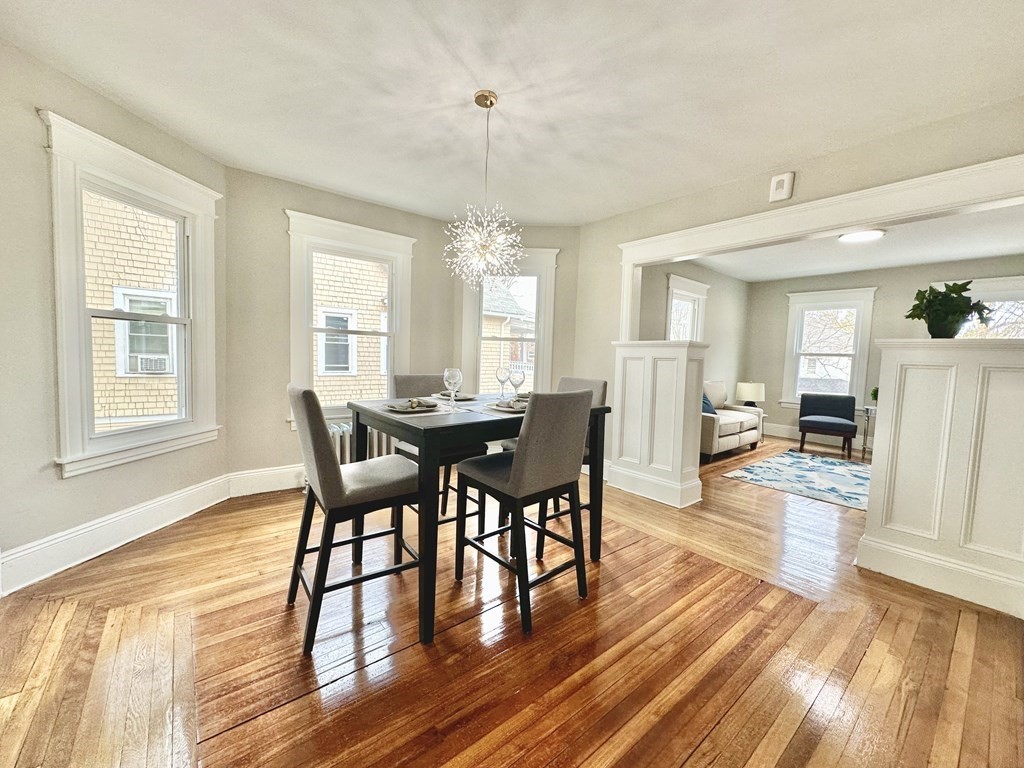 38-40 Pasadena Street Springfield, MA 01108 - Photo 3 of 37 a view of a dining room with furniture and wooden floor