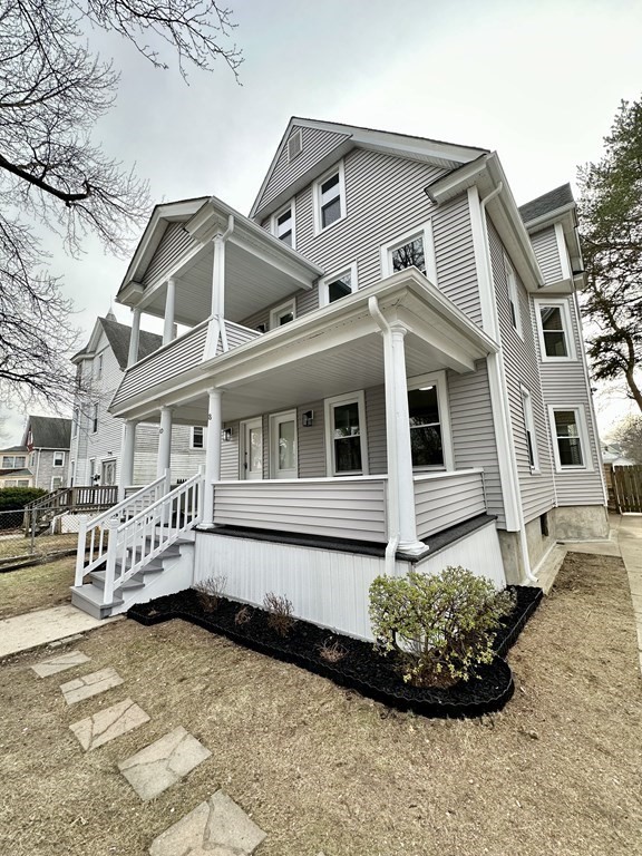 38-40 Pasadena Street Springfield, MA 01108 - Photo 35 of 37 a front view of a house with a garden