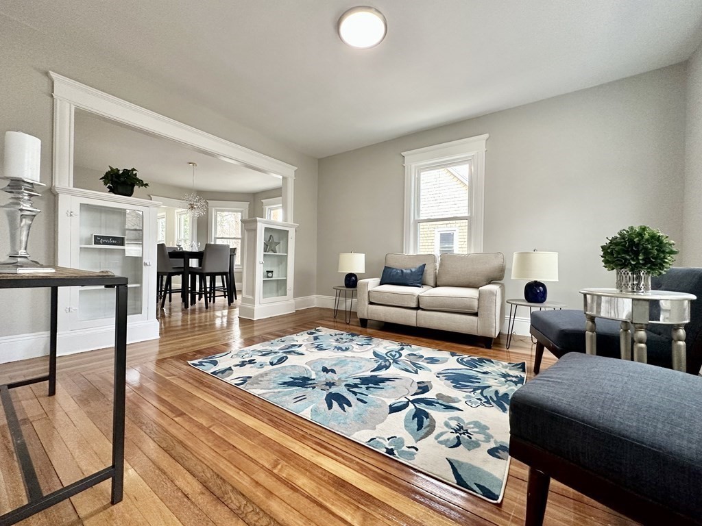 38-40 Pasadena Street Springfield, MA 01108 - Photo 7 of 37 a living room with furniture a rug and a table