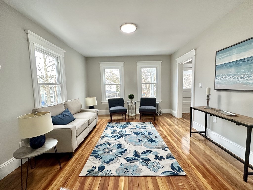 38-40 Pasadena Street Springfield, MA 01108 - Photo 9 of 37 a living room with furniture and a rug
