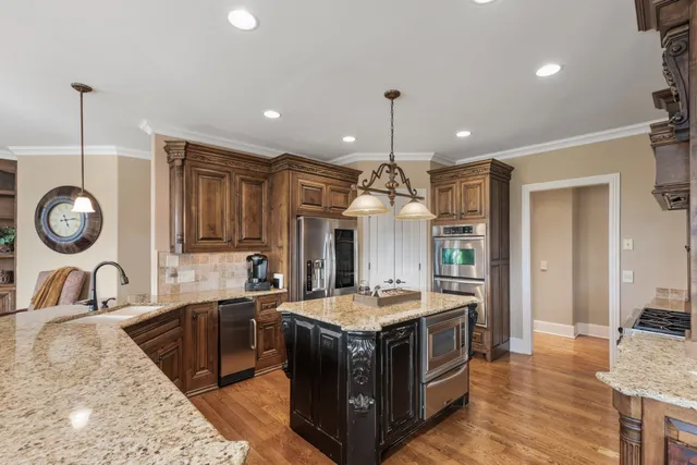 a stove top oven sitting inside of a kitchen