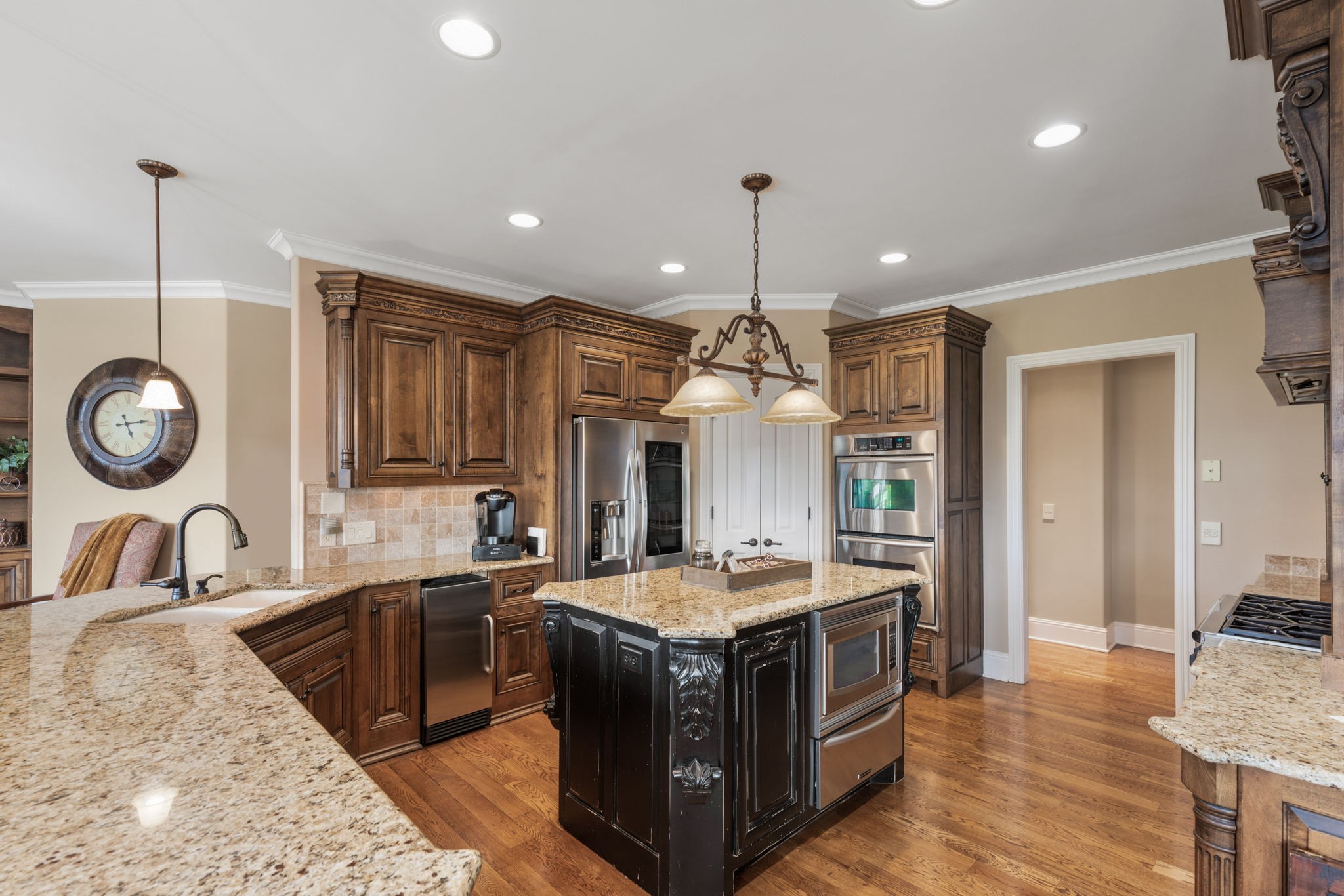 763 Plantation Way Gallatin, TN 37066 - Photo 11 of 65 a kitchen with a stove and a sink