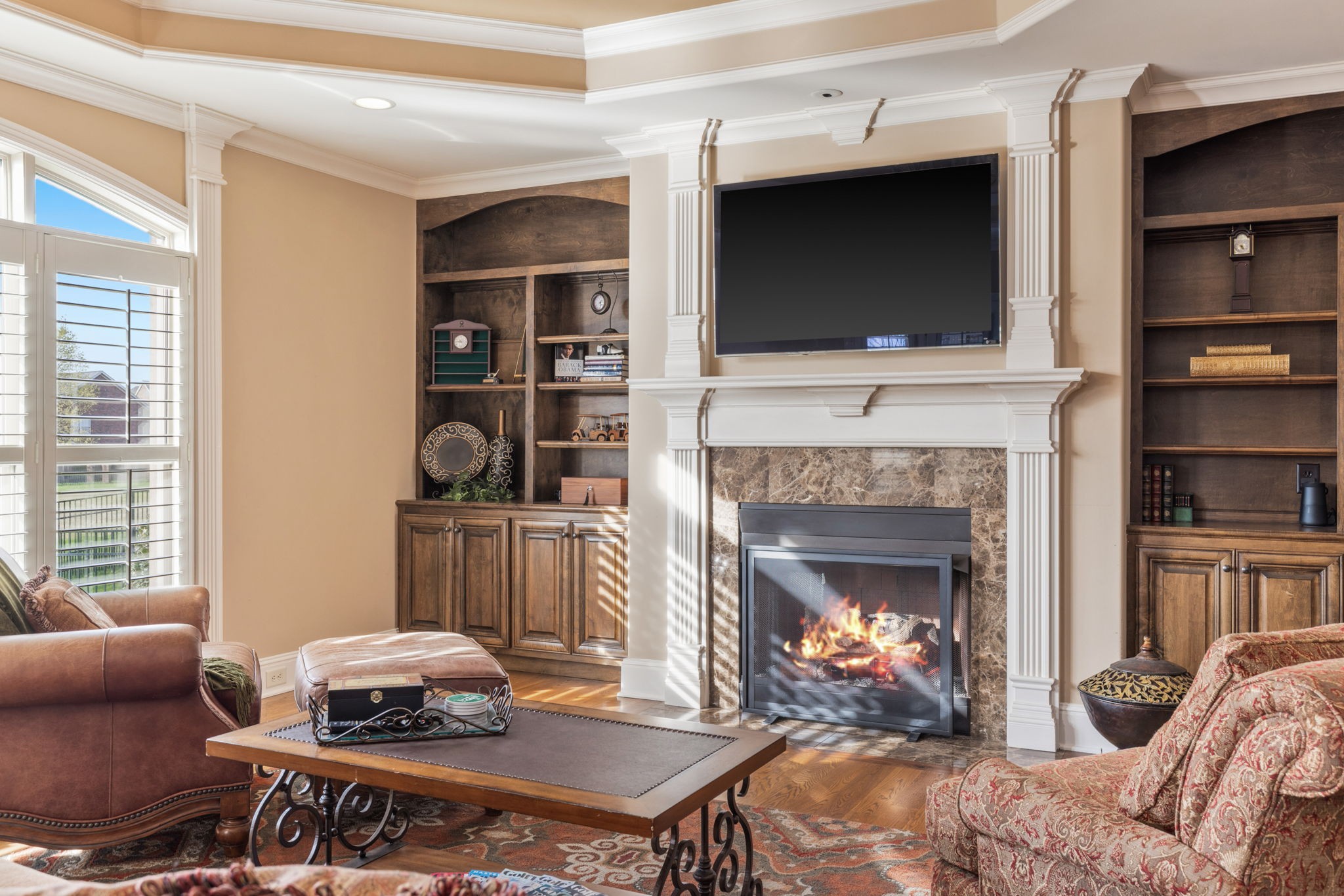 763 Plantation Way Gallatin, TN 37066 - Photo 17 of 65 a living room with furniture a flat screen tv and a fireplace