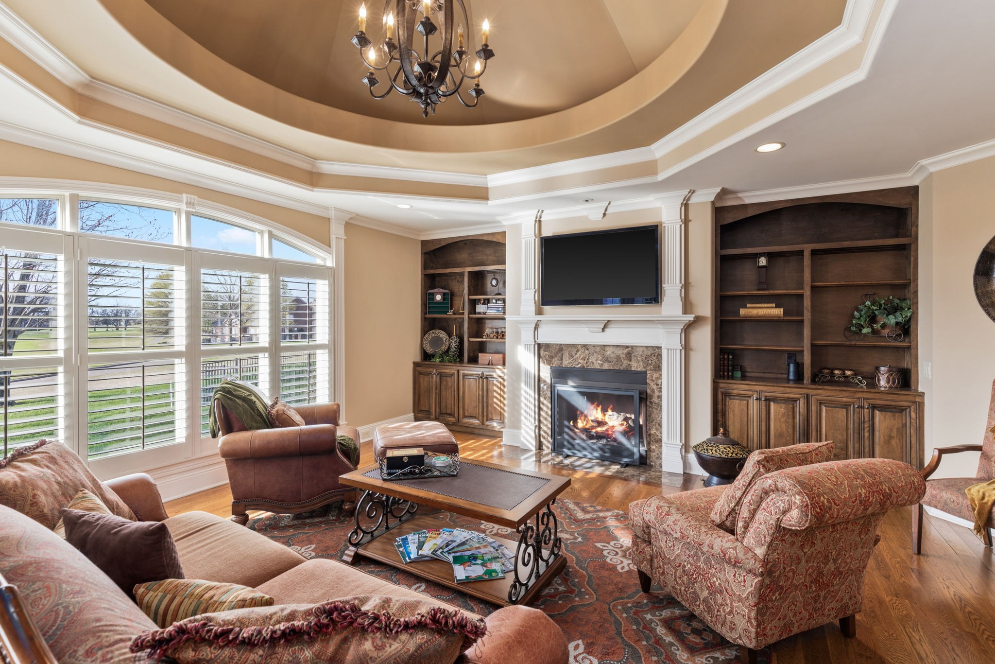 763 Plantation Way Gallatin, TN 37066 - Photo 18 of 65 a living room with furniture a fireplace and a large window