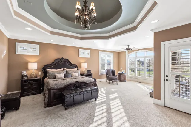a bathroom with a tub a double vanity sink and mirror