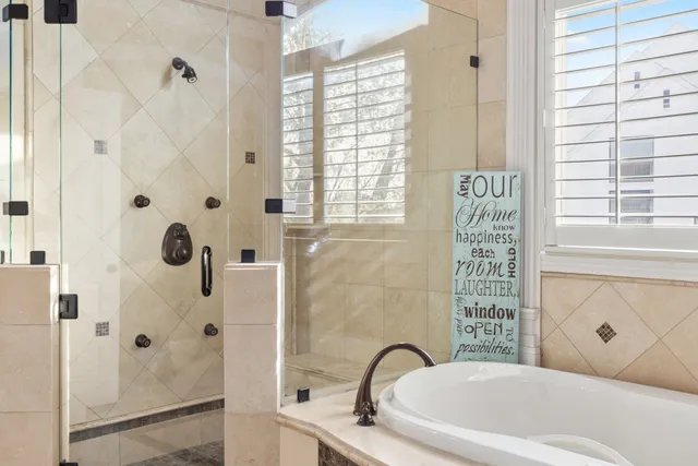a bathroom with a granite countertop sink mirror vanity and toilet