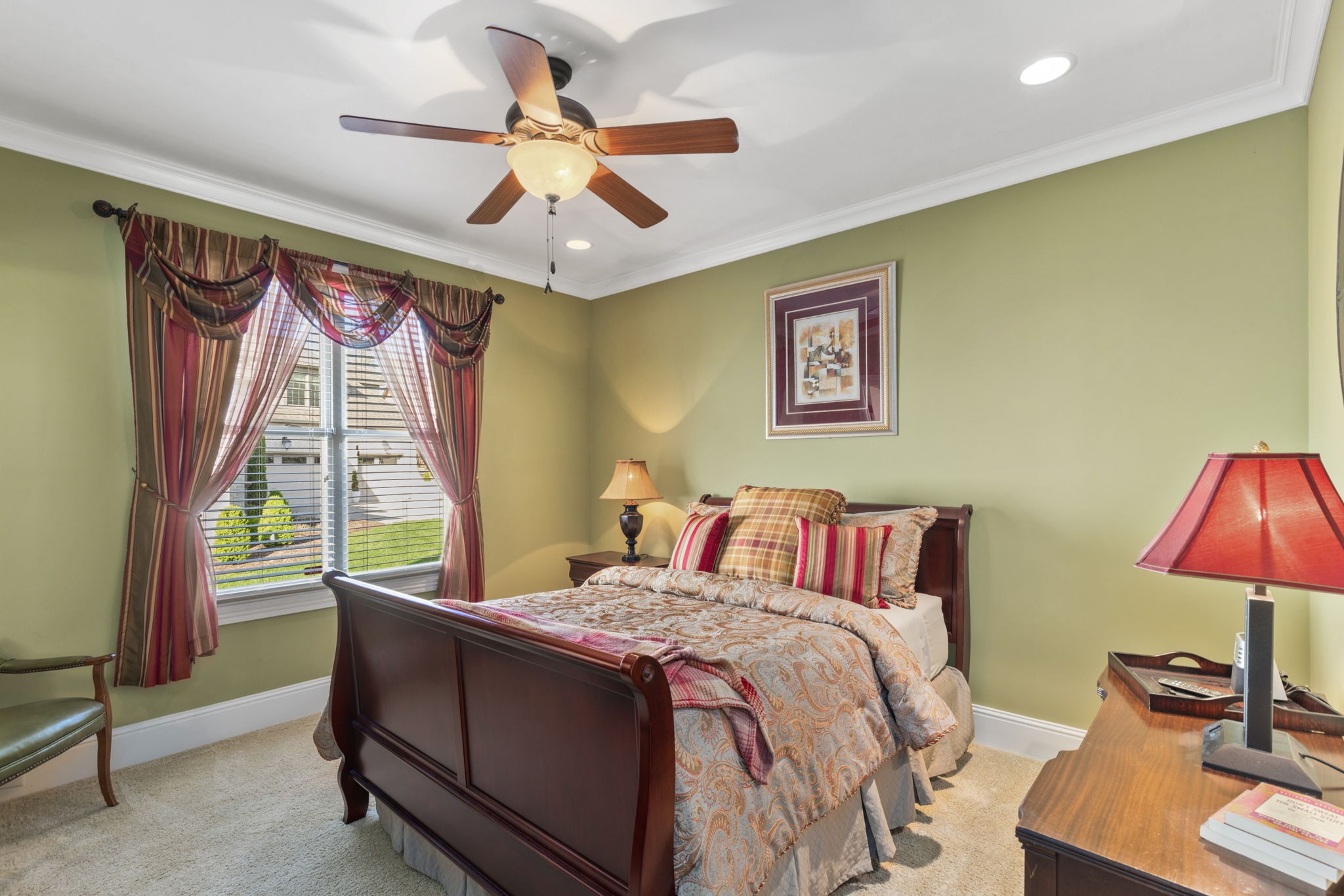 763 Plantation Way Gallatin, TN 37066 - Photo 33 of 65 a bedroom with a bed and a chandelier