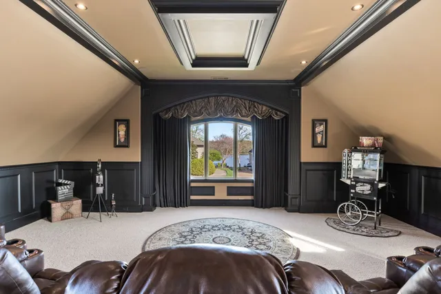 a front view of a house with a large window and furniture